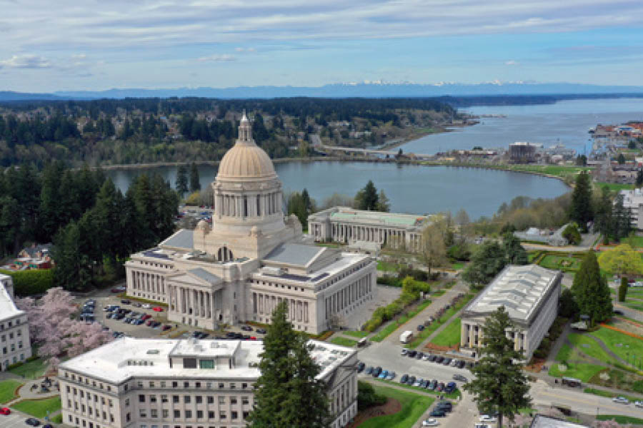 An aerial photo of the Olympia statehouse with the water in the background