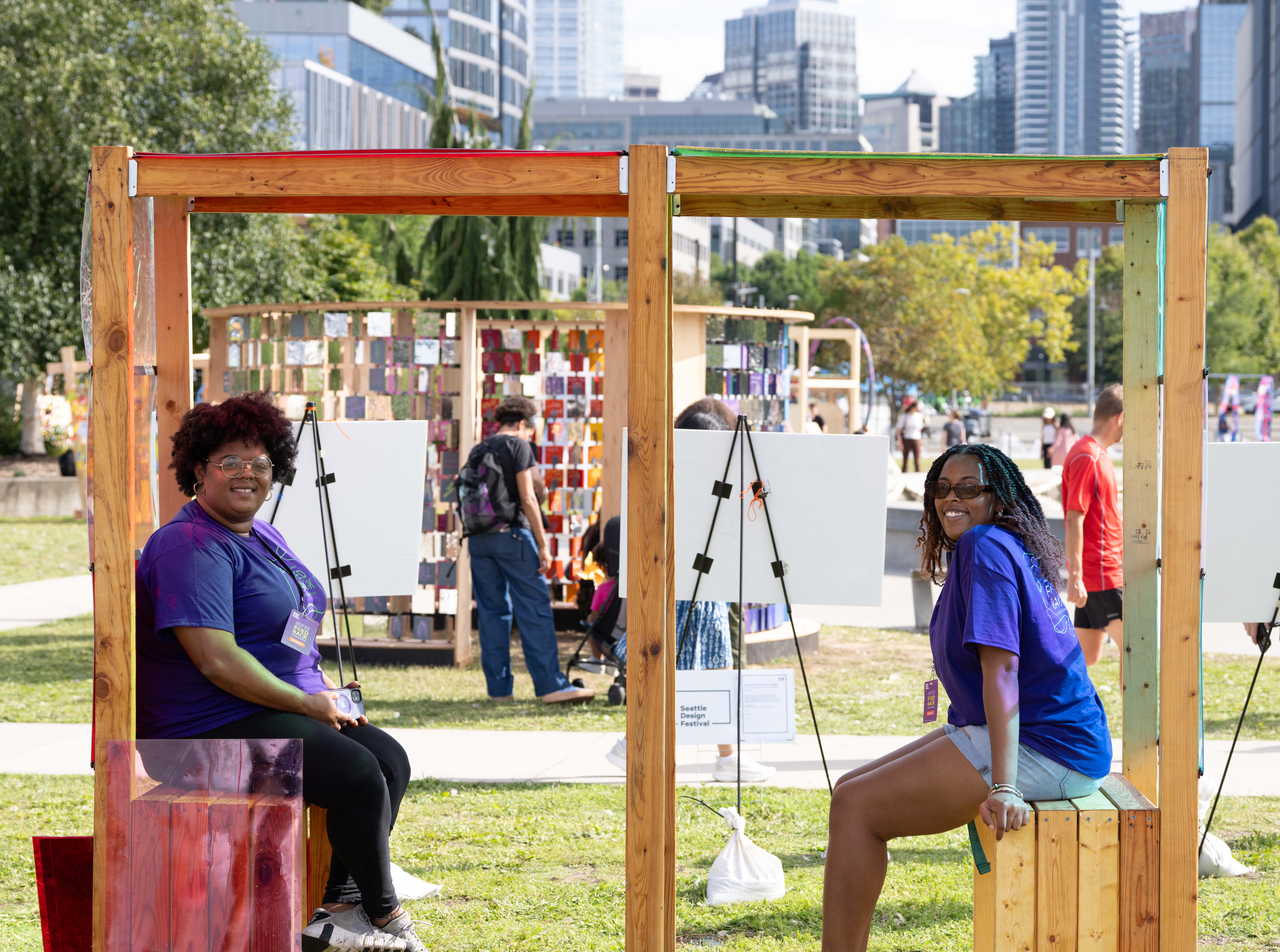 attendees at the 2025 Seattle Design Festival sit inside an installation and are looking at the camera